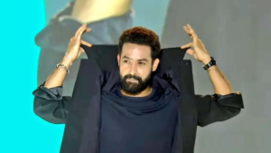 Jr NTR intense look in War 2 movie poster with dramatic lighting
